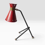 Front three-quarter view of the red diabolo shade table lamp with brass collar, attr. René Mathieu for Maison Lunel, 1950s
