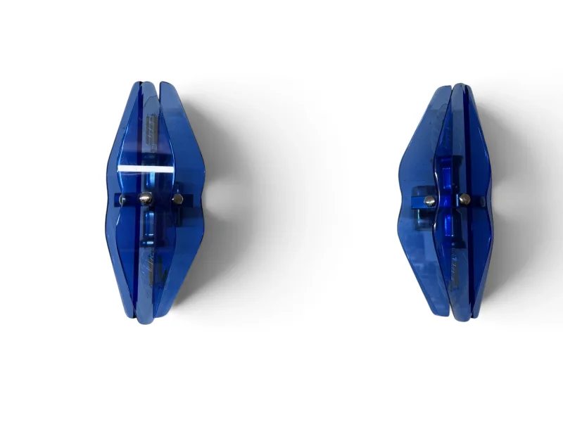 Pair of VECA blue glass wall sconces side by side, front view of both sconces