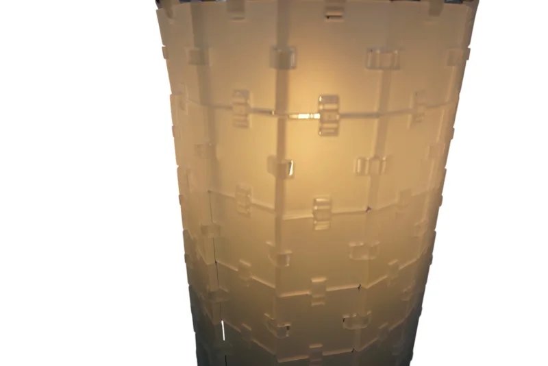 Close-up of the illuminated Flos Bloc T shade, octagonal structure built from individual plastic modules
