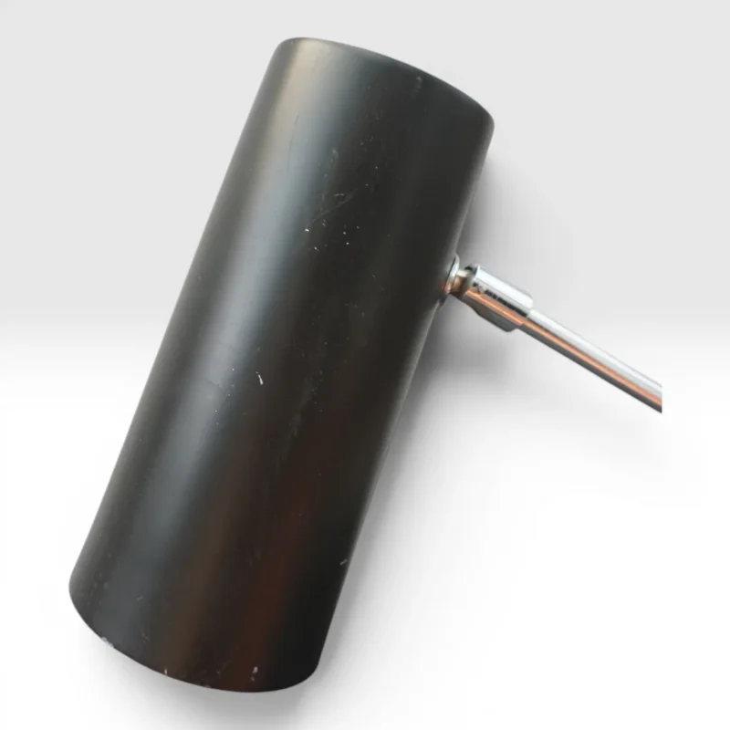 Detail of the black lacquered cylindrical metal shade of the Ateljé Lyktan 781B desk lamp