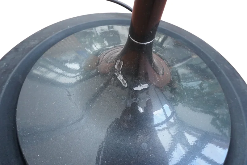 Arteluce Corolle floor lamp base showing extensive lacquer flaking and paint loss at stem connection point, restoration condition