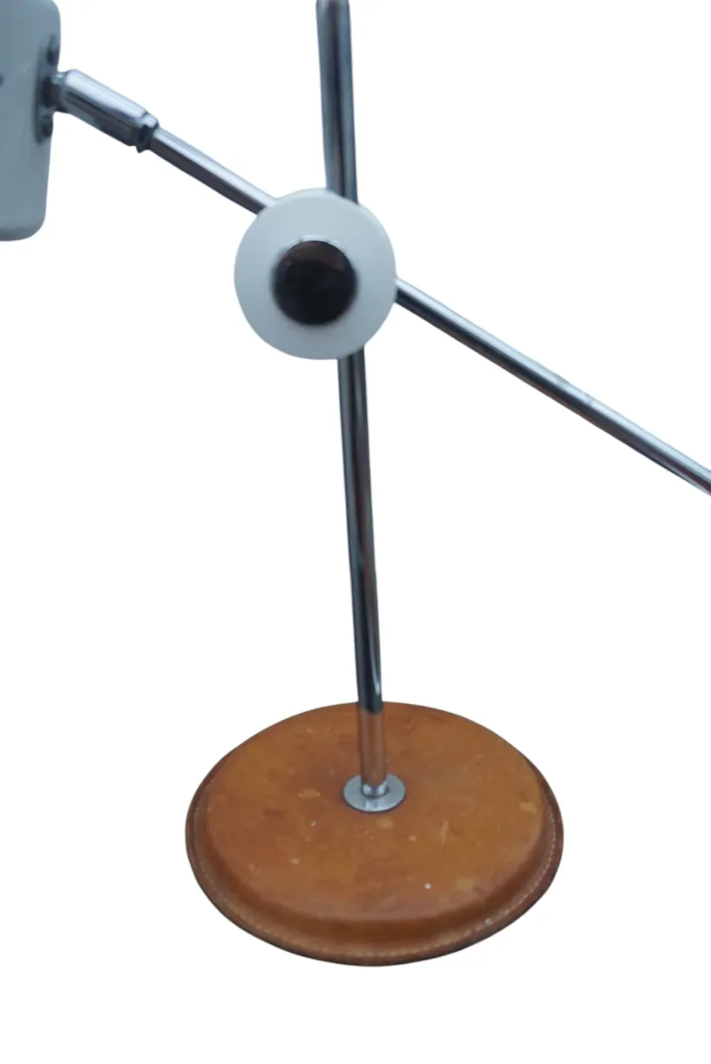 Pivot joint of the Simris table lamp by Anders Pehrson with grey disc, chrome knob and adjustable chrome arm