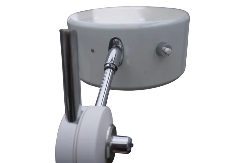 Pivot joint of the Simris table lamp by Anders Pehrson with grey disc, chrome knob and adjustable chrome arm