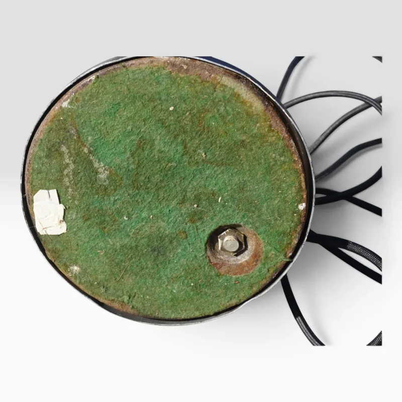 Underside of the round base on the Hala Zeist model 144 desk lamp, showing aged patina and original wiring