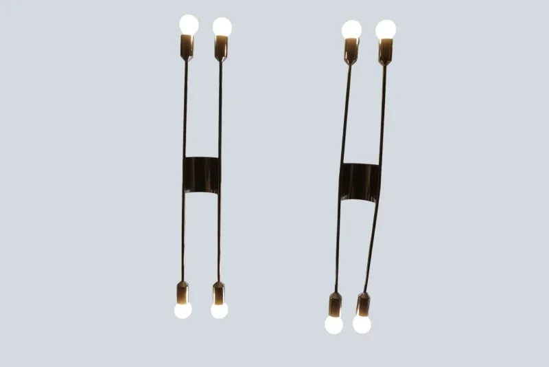 Pair of Cosack model 4166 wall sconces lit up, each with two double-ended arms and four exposed bulbs