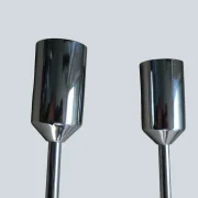 Two chrome finial end caps on rods of a pair of Cosack model 4166 wall sconces, shown side by side