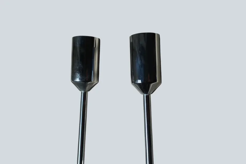 Close-up comparison of the chrome end caps on a pair of Cosack 4166 wall sconces