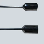 Close-up of two polished chrome finial caps on the Cosack model 4166 wall sconce pair