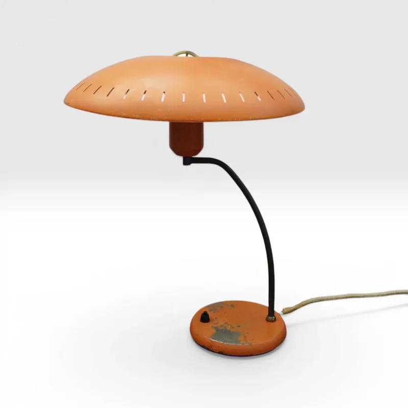 Philips Junior table lamp by Louis Kalff, orange lacquered steel with perforated mushroom shade and curved black arm, 1950s
