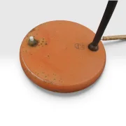 Close-up of Philips Junior base showing embossed Philips manufacturer mark, on/off switch and brass fittings